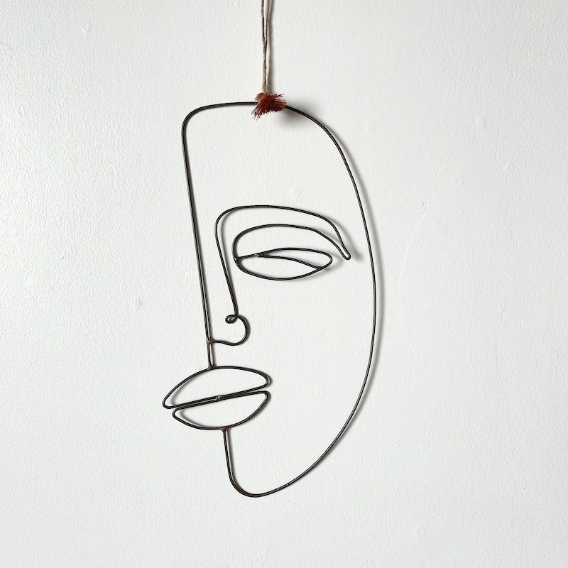 Hanging iron face deco by Madam Stoltz